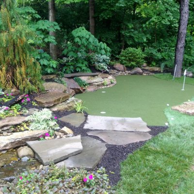 Custom Putting Green With Landscape Desgin and Water Feature