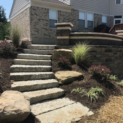 Stone Steps leading to a paver patio